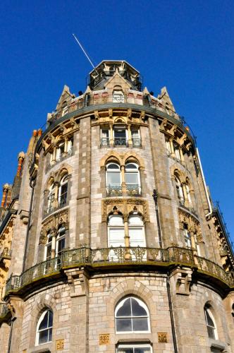 a tall building with a clock on the top of it at Duke Of Cornwall Hotel in Plymouth