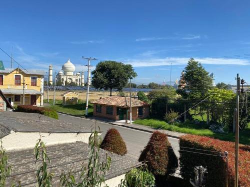a view of a street with a building in the distance at Hotel Villa Mercedes Colonial in Sopó