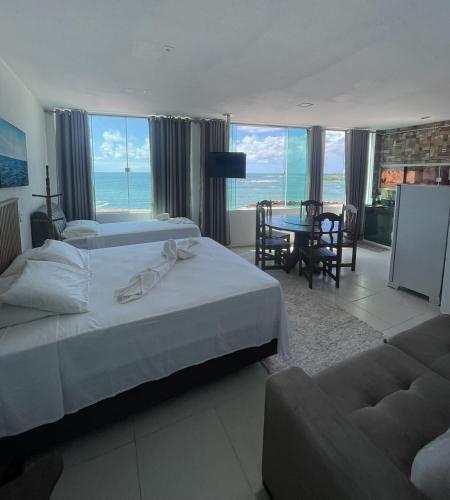 Ένα ή περισσότερα κρεβάτια σε δωμάτιο στο Flat Morro de São Paulo e Casa Blanca