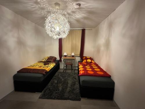 Ένα ή περισσότερα κρεβάτια σε δωμάτιο στο Ferien & Monteur Wohnung 1 - Little Afrika Extensive 5 Zimmer Wohnung