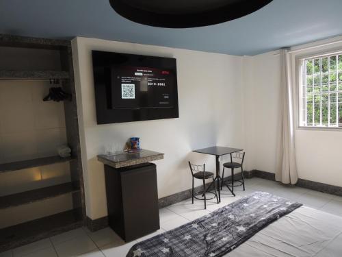 TV a/nebo společenská místnost v ubytování Lourdes Prime Hotel - Fácil Acesso Savassi