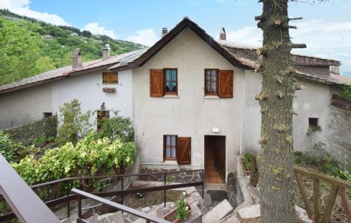 a house with a tree in front of it at Gorgeous Home In Serrone With Wifi in Serrone