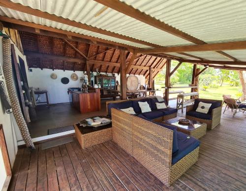 an outdoor living room with couches and a table at Matevulu Lodge in Luganville