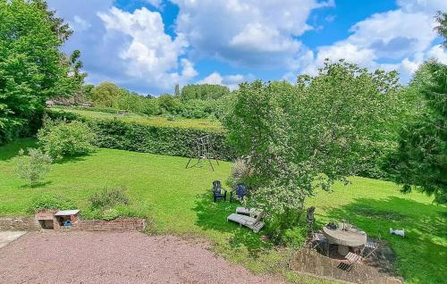 an overhead view of a park with benches and a tree at Cozy Home In Saint-Pierre-En-Auge in Sainte-Marguerite-de-Viette