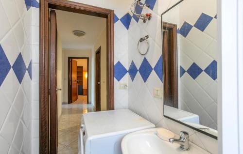 a bathroom with a sink and a mirror at Cozy Apartment In Messina With House Sea View in Briga Marina
