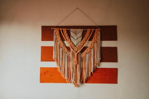 a bunch of accordions hanging on a wall at Grann Posada Xilitla in Xilitla
