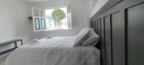Postel nebo postele na pokoji v ubytování Aparta hotel natural