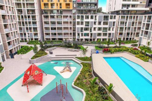 an aerial view of an apartment complex with a swimming pool at Olympic Park Stadium Cozy 1 bedroom Apt in Sydney