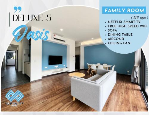 a living room with a couch and a tv at Roxy Sematan Beach Townhouse Deluxe 3 ,5 & 6 in Sematan