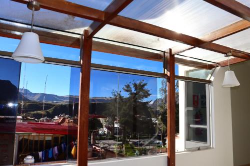 a window with a view of a marina at Sierra Alta Colca in Chivay