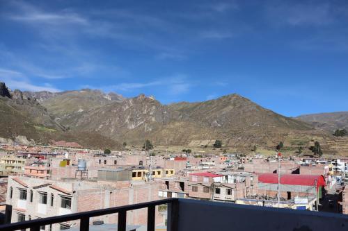 a view of a city with mountains in the background at Sierra Alta Colca in Chivay