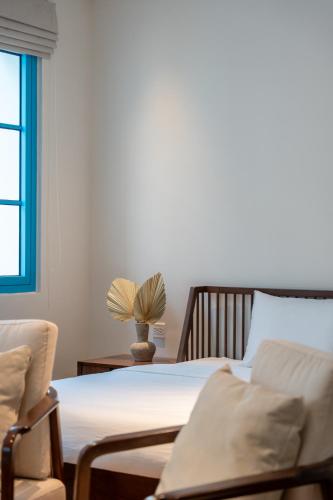 Ένα ή περισσότερα κρεβάτια σε δωμάτιο στο domdomHOUSE Villa - 1min walk to beach