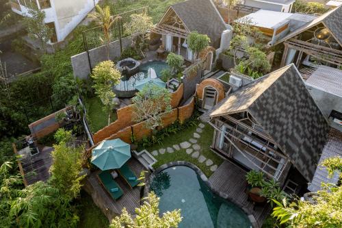 an aerial view of a house with a swimming pool at Agastya Ubud Villa in Ubud