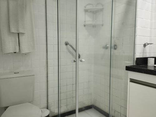 a bathroom with a shower and a toilet at FLAT PONTA NEGRA BEACH-Natal in Natal