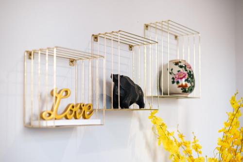 a black cat in a cage on a wall at StayAU Stylish Spacious 4BR Home Ringwood in Ringwood East