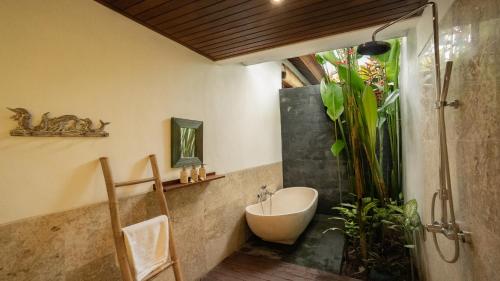 a bathroom with a sink and a bath tub at Villa Maya Ubud, Peaceful Rice Field View in Ubud