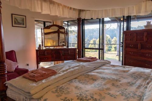 Ένα ή περισσότερα κρεβάτια σε δωμάτιο στο Blue Moon Forest Lodge