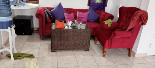 Coin salon dans l'établissement RADHA APARTMENTS Stay