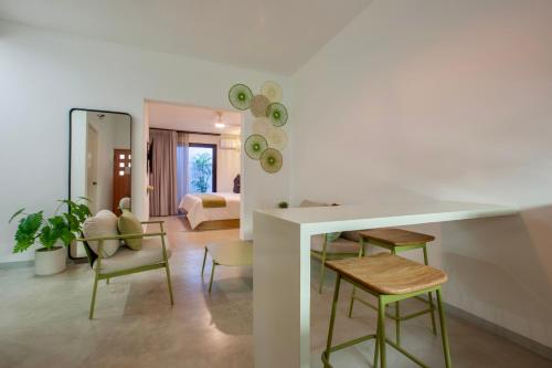 a living room with a table and chairs at Quinta Lolita - La Paz Baja California Sur in La Paz
