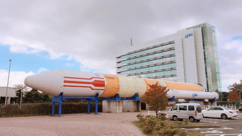 a large building with a space shuttle in front of it at Toyoko Inn Kenkyu-gakuen Ekimae in Tsukuba