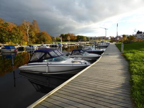 a group of boats docked at a dock at Brohuspark in Lomma