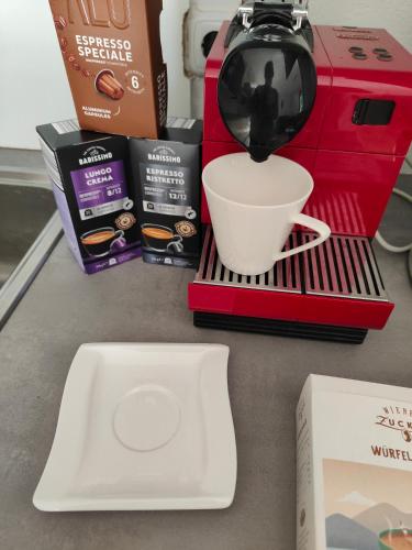 a coffee maker sitting on a counter with a cup at Ferienwohnung Waldblick, nahe Jennersdorf und Therme in Windisch Minihof