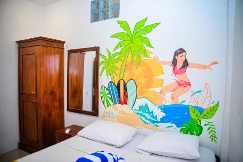 Ένα ή περισσότερα κρεβάτια σε δωμάτιο στο Tuti House Gili Trawangan