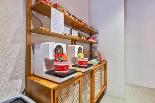 a shelf with some food and drinks on it at Gyeongju Hotel Gonggan in Gyeongju