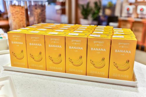 a bunch of bananas in yellow boxes on a counter at Gyeongju Hotel Gonggan in Gyeongju