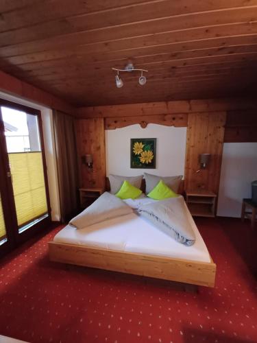 a bedroom with a bed in a wooden room at Haus Helene Prantl in Längenfeld