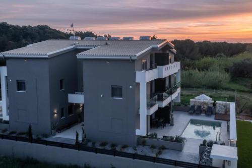 an aerial view of a house with a sunset at CHE BELLO NATURE in Preveza