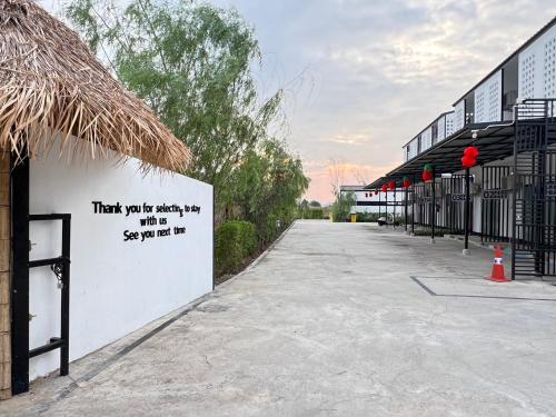 a building with a sign that says that youll safety you will be supervised at Penguin Villa Resort & Bistro in Ratchaburi