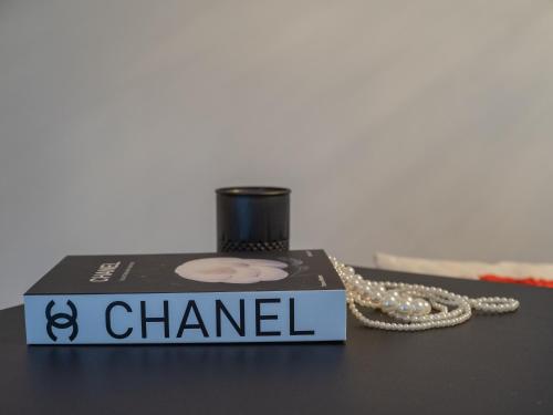 a chanel box with a chain on a table at Maison Idyllique in Bree