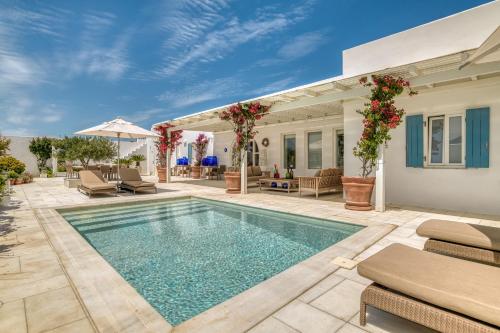 a swimming pool in the backyard of a house at Villa Bellonia in Naousa