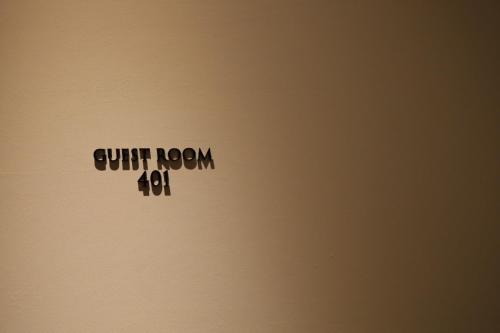 a sticker on a laptop with the words quit room at Hotel Rakurakuan in Kyoto