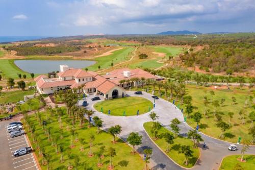 an aerial view of a house with a park and a lake at Villa 028 - Villa Novaworld Phan Thiet View Biển - 4BR - 3 Toilet in Phan Thiet