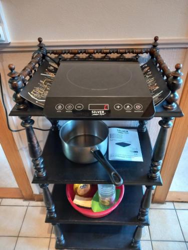 a stove top oven sitting on top of a shelf at Liberation in Mulhouse