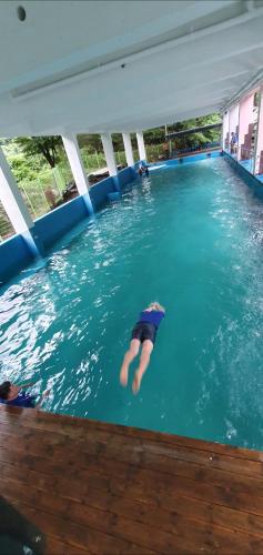 a person is swimming in a swimming pool at Green Valley in Sancheong