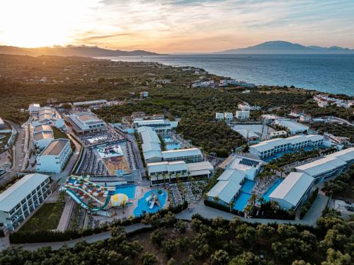 an aerial view of a resort next to the ocean at Caretta Paradise Resort & WaterPark in Tragaki
