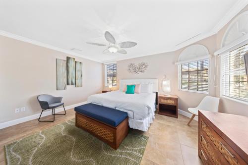 a bedroom with a bed and a table and a chair at Divi Village Condo 33 J.E. Irausquin Blvd 93 in Palm-Eagle Beach