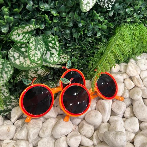 two pairs of sunglasses sitting on a pile of rocks at Hotel bridge Seogwipo in Seogwipo