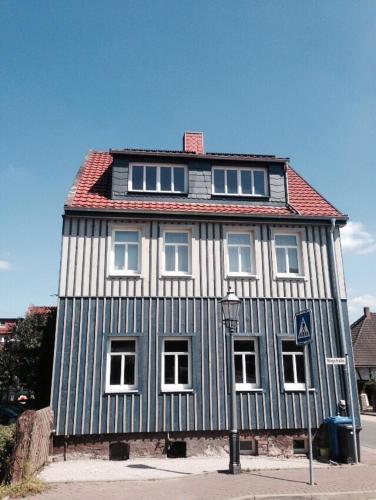 a black and white house with a red roof at Casa Meloni in Bad Sachsa