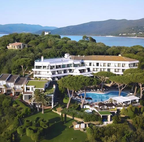 an aerial view of a resort with a swimming pool at Cala del Porto Punta Ala - Preferred Hotels in Punta Ala