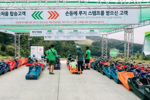 a group of motorcycles parked under a bridge at Wellihilli Park Resort in Hoengseong