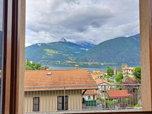 a view of a town with mountains and a lake at Casa Sofi by Quokka 360 - near Rezzonico Castle in Rezzonico