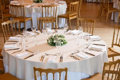 a table set up for a wedding with wine glasses at KRESTEN ROYAL Euphoria Resort in Kallithea Rhodes