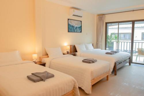 Postel nebo postele na pokoji v ubytování Maiiam Guesthouse Patong