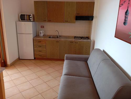 Η κουζίνα ή μικρή κουζίνα στο A.I.R. Hotel Gabbiano