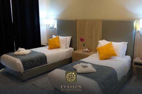 Katil atau katil-katil dalam bilik di Liberté Hotels Oran