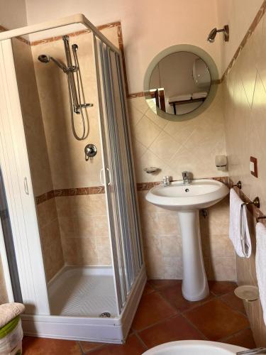 a bathroom with a shower and a sink at Country House B&B Antica Dimora Del Sole in Camerota